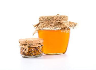 Tatlım, petek, polen ve propolis bir beyaz ile natürmort