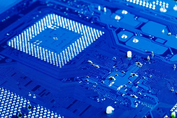 blue circuit board background of computer motherboard,Electronic computer hardware technology.Integrated communication processor. Information engineering component. Blue color.