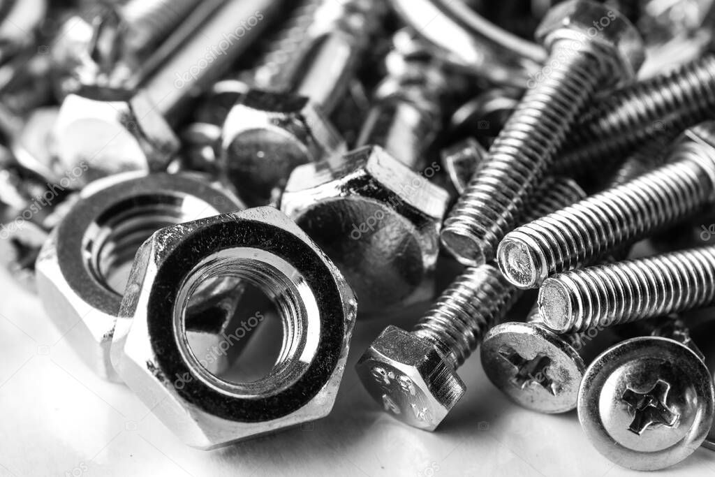 Mixed screws and nails. Industrial background. Home improvement.bolts and nuts.Close-up of various screws. Use for background, top view.