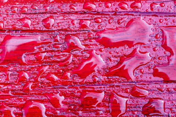 Abstract Patroon Van Waterdruppels Een Rood Beschilderd Houten Oppervlak Regen — Stockfoto