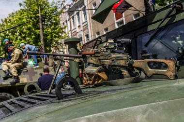 Machine gun Kalashnikov on the tripod and optical sight.M249 light machine gun with 7.62 mm cartridge belt.Military action in the world.