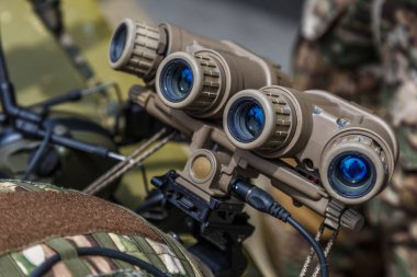 Us military tactical helmet Velcro.Night vision device attached to the helmet. A special device for observing in the dark. Equipment for the military, police and special forces.