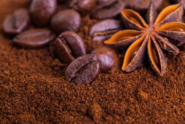 Close-up of coffee beans on pile of roasted coffee. Coffee beans clipart