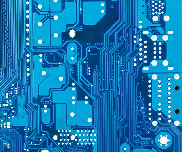 Close-up of electronic circuit board with processor blue backgro — Stock Photo, Image