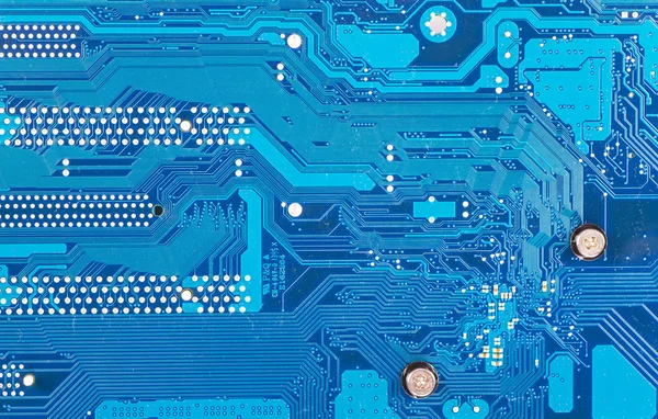 コンピュータマザーボードの青い回路基板の背景 — ストック写真