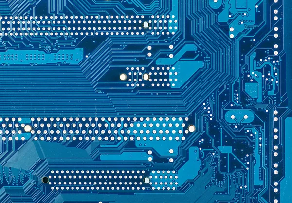 コンピュータマザーボードの青い回路基板の背景 — ストック写真
