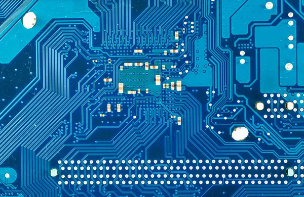 Close-up of electronic circuit board with processor blue backgro — Stock Photo, Image