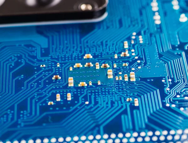 Blue circuit board background of computer motherboard close up — Stock Photo, Image