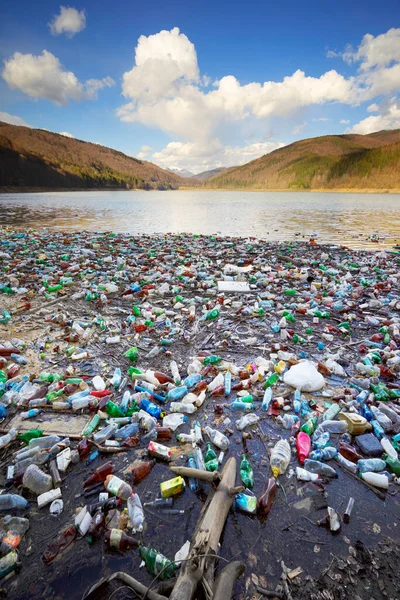 Environmental disaster in Transcarpathia, Ukraine. Residents of mountain villages throw plastic waste directly into the rivers, which bring it to the reservoir and dump it on its banks. Low ecology.