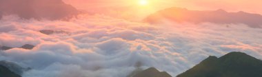 fog In mountains at sunrise clipart