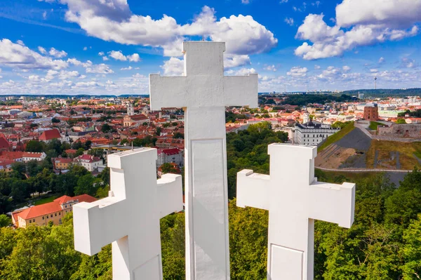 Aerial view of the Three Crosses monument overlooking Vilnius Old Town. Vilnius landscape from the Hill of Three Crosses, located in Kalnai Park, Lithuania.