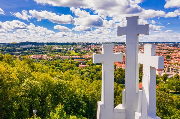 Aerial view of the Three Crosses monument overlooking Vilnius Old Town. Vilnius landscape from the Hill of Three Crosses, located in Kalnai Park, Lithuania.