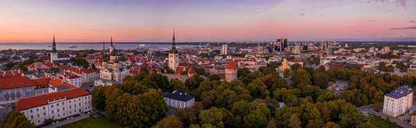 Amazing aerial drone shot of old town of Tallinn, Estonia at sunset. Beautiful panorama of Tallinn.