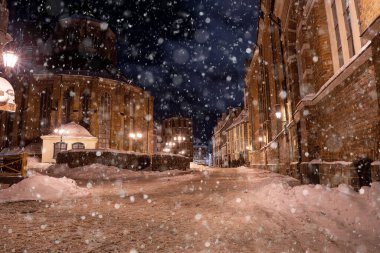 February 10, 2021. Riga, Latvia. Beautiful winter night in the old town of Riga, Latvia. View of the narrow Riga streets.