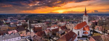 Cesis, Latvia. May 01, 2021. Drone aerial view of medieval old city. One of the beautiful town in Europe. Landscape to the city center and its historical buildings and old castle ruins. 