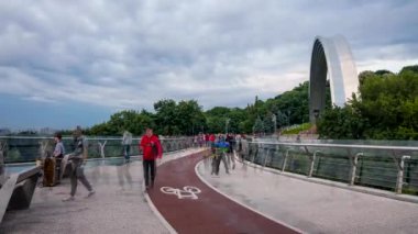 Kyiv, Ukraine. June 05, 2021. Time lapse view of the new pedestrian bridge in Kiev, Ukraine, opened in 2019 connecting to Saint Volodymyr Hill.