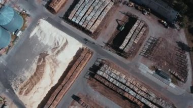 Warehouse of felled trees at the factory. Aerial view of the fallen trees