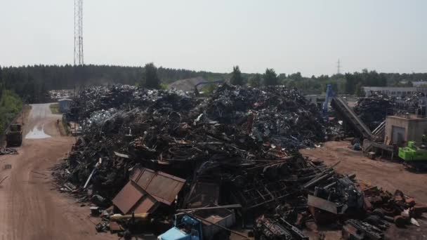 Old wrecked cars in junkyard waiting to be shredded in a recycling park — 비디오