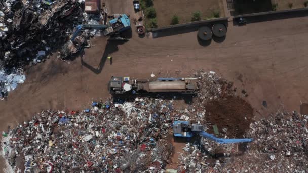 Old wrecked cars in junkyard waiting to be shredded in a recycling park — 비디오