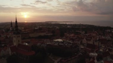 Beautiful aerial drone shot of old town of Tallinn, Estonia at sunset