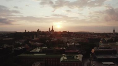 Beautiful aerial drone shot of old town of Tallinn, Estonia at sunset