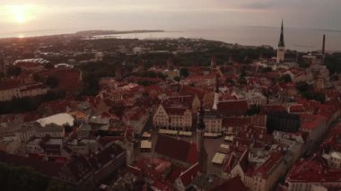 Beautiful aerial drone shot of old town of Tallinn, Estonia at sunset