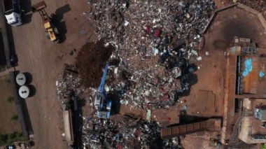 Old wrecked cars in junkyard waiting to be shredded in a recycling park