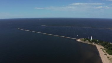 Aerial view of the lighthouse and mole at river Daugava in Latvia.