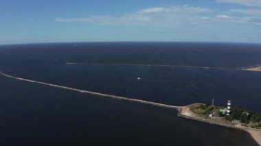 Aerial view of the lighthouse and mole at river Daugava in Latvia.