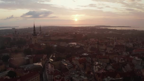 Beautiful aerial drone shot of old town of Tallinn, Estonia at sunset — Stok video