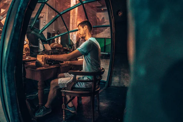 Young man reading a book in a fairytale submarine. —  Fotos de Stock