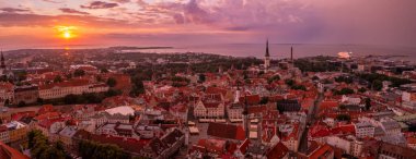 Panoramic view of Old Tallinn city at purple sunset, Estonia.