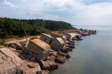 Ruins of bunkers on the beach of the Baltic sea