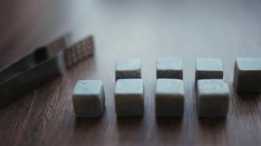 Set of nine spirit chilling stones. Soapstone rocks are carved in cubes