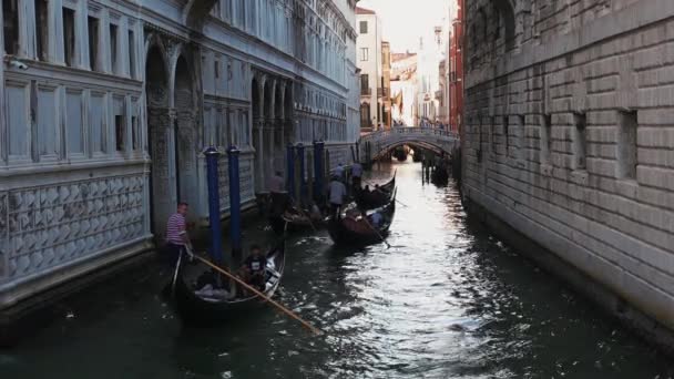 Traditional gondolas on narrow canal in Venice, Italy — Stock Video