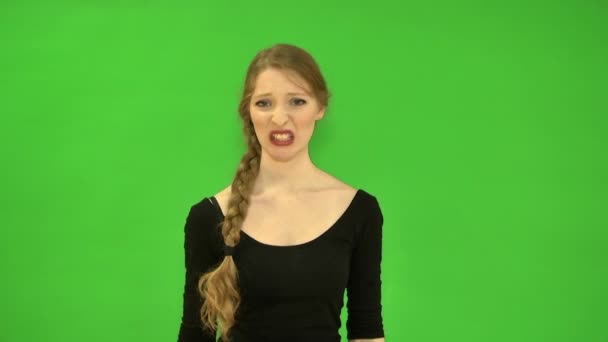 Pretty young woman with disgust refuses. — Stock Video