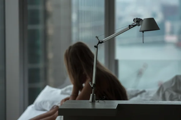 Lonely woman in the bed — Stock Photo, Image