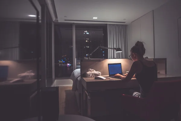Young woman overworking in the office