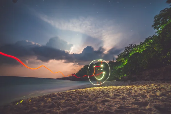 Smile drawn in the air with freeze light — Stock Photo, Image