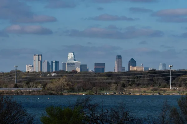 The skyline of the city of Dallas, Texas as seen looking across the water from the east shore of White Rock Lake.