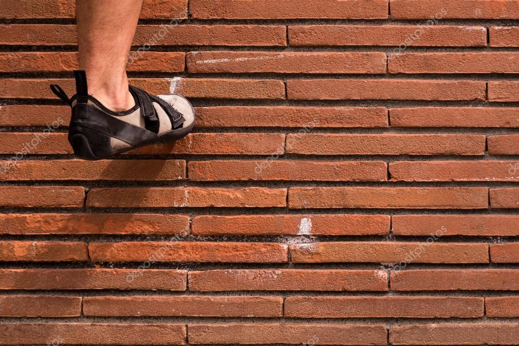 Climbing a red brick wall Stock Photo by ©paolocremonesi 118270476