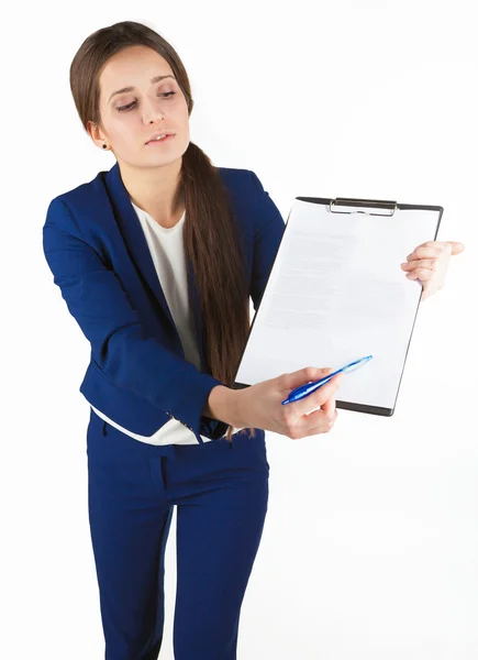 Woman lady in blue points out the place for signature in her document isolated. Stock Photo