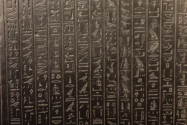 Hieroglyph on a black stone — Stock Photo, Image