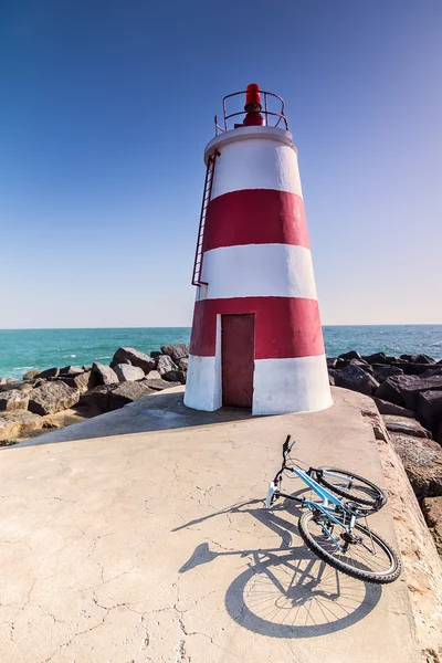 Lighthouse and bike in Portimao — Stock Photo, Image