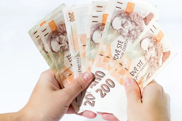 Female hand holding czech banknotes — Stock Photo, Image