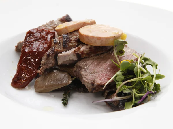 Roast beef served on a white dish — Stock Photo, Image