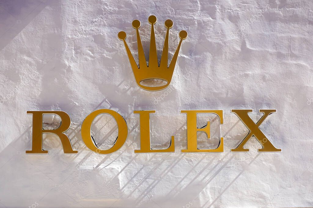 ROME, ITALY - DECEMBER 10, 2020 : Rolex logo on street. Rolex is a manufacturer of high-quality, luxury wristwatches. Trademark was registered in 1908 in Switzerland .