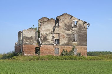 abandoned house with the blue sky background