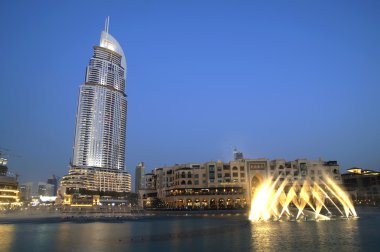 DUBAI, UAE - 17 JUNE 2015 : Promenade in Dubai Marina at night, UAE. Dubai Marina is a district in Dubai with artificial canal city who accommodates more than 120,000 people at Persian Gulf.
