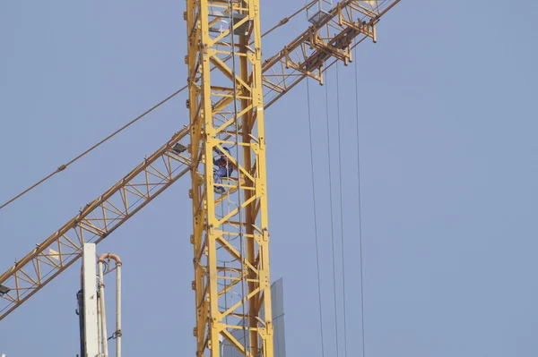 Arm of crane within a construction site — Stock Fotó